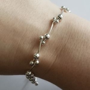 Dainty curved bar and bead bracelet silver tone